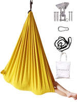 The Retro Pineapple Sensory Swing with swint contents next to it.