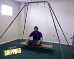 An adult sitting on the Adult Carpeted Platform Swing Seat.