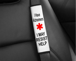 The Alzheimers Seatbelt Cover on a seatbelt. The text reads: I MAY RESIST HELP.