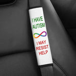 The Autism Seatbelt Cover on a seatbelt. Text reads: I Have Autism: I May Resist Help.