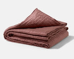 The 15b Cocoa colored Gravity Cooling Weighted Blanket folded neatly.