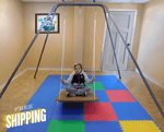 Child sitting on the HPSI Portable Swing Frame with Swivel.