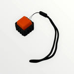The orange Spiky Mechanical Keyboard Fidget - Clicky.