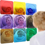 A child looks into 9 different colored Bubble Wall Mirrors.