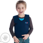 A child smiling while wearing the Blue Weighted Compression Vest.