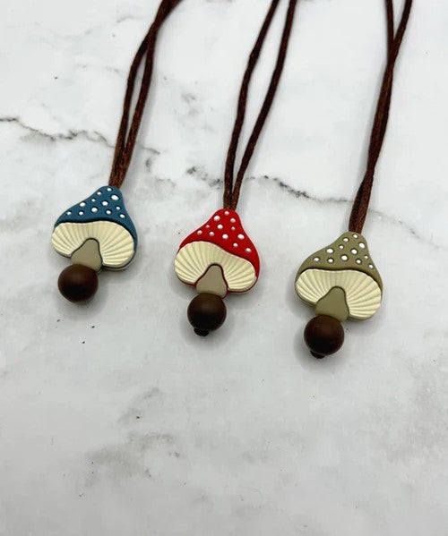three mushroom necklaces that are chewable