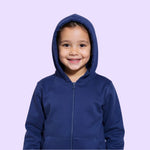 A child smiles and wears the hood up on the Navy Zippered Sound Reducing Sensory Hoodie.