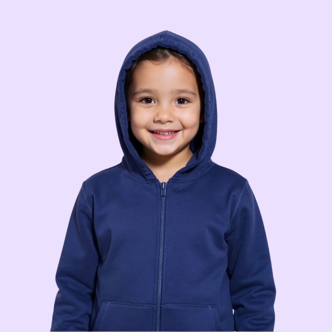 A child smiles and wears the hood up on the Navy Zippered Sound Reducing Sensory Hoodie.