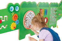A child with light skin tone and a blonde top pony tail plays with the maze on the Crocodile Activity Wall Panels.