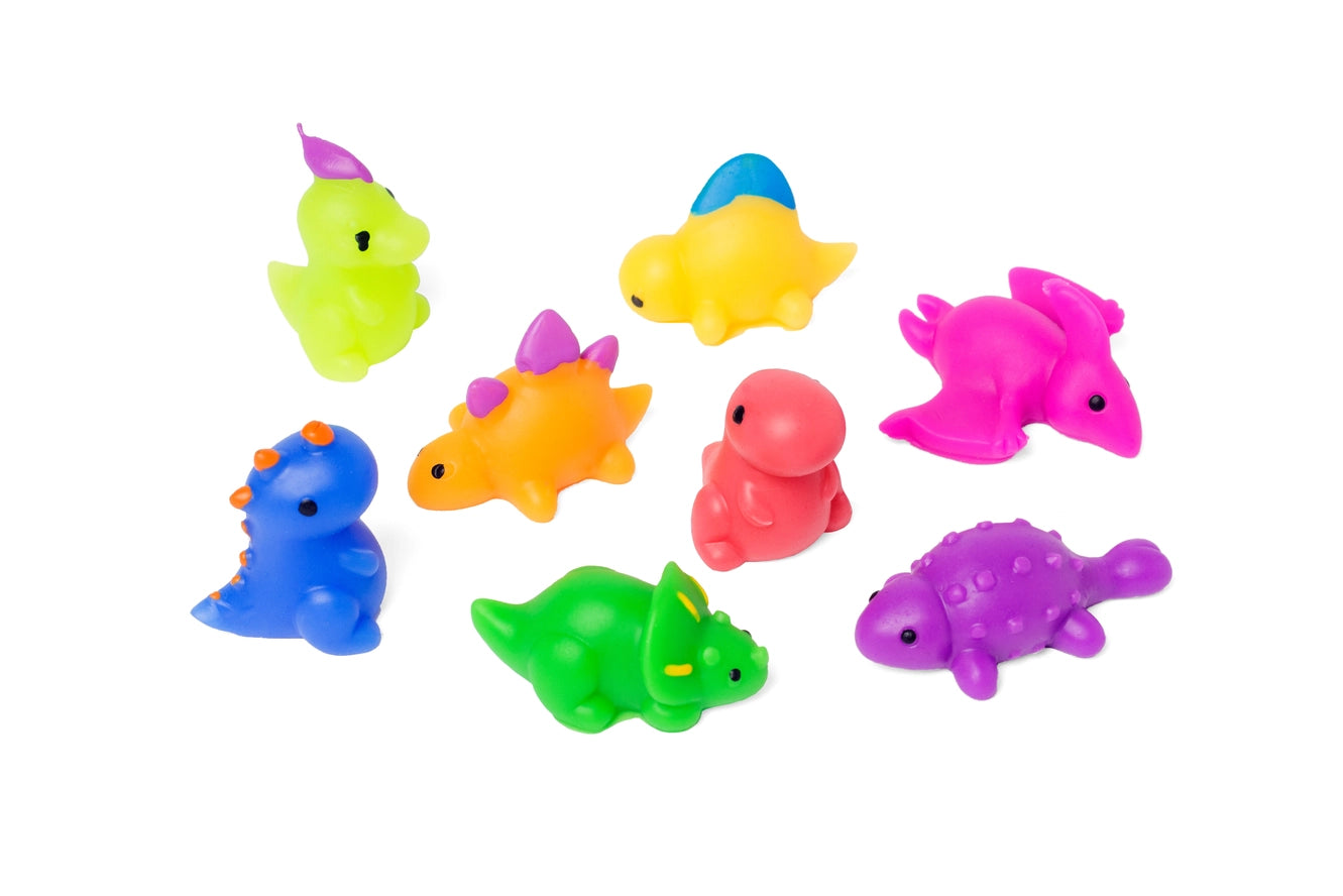The assorted mystery squishy dinosaurs that come in the Tie Dye Dinosaur Mystery Bath Bomb.