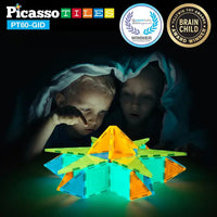 Two children are under a blanket observing the glow of a small structure built by the 60 Piece Glow-in-the-Dark Tileset.