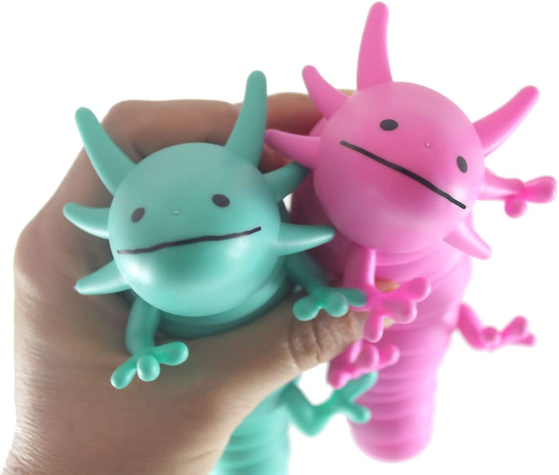 A hand with light skin tone holds up a teal and a pink Wiggle Sensory Axolotl.