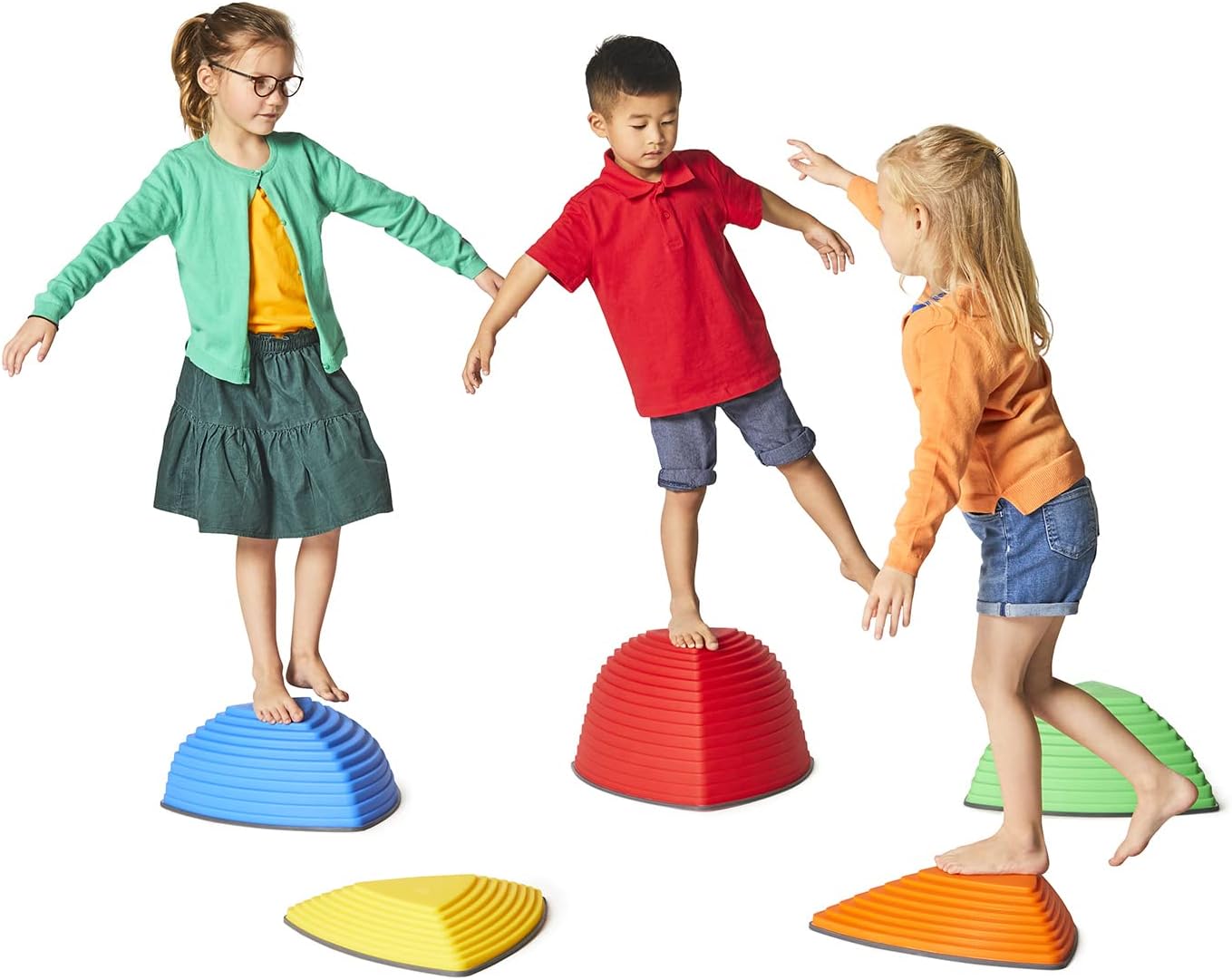 Three children all try to balance on different sized Gonge Hilltops.