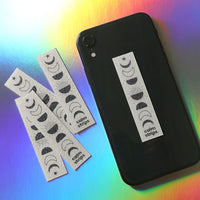 A Moon Phases Calm Strip on the back of a cell phone.
