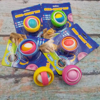 Several color variations of the Gyro-Fidget Toy.