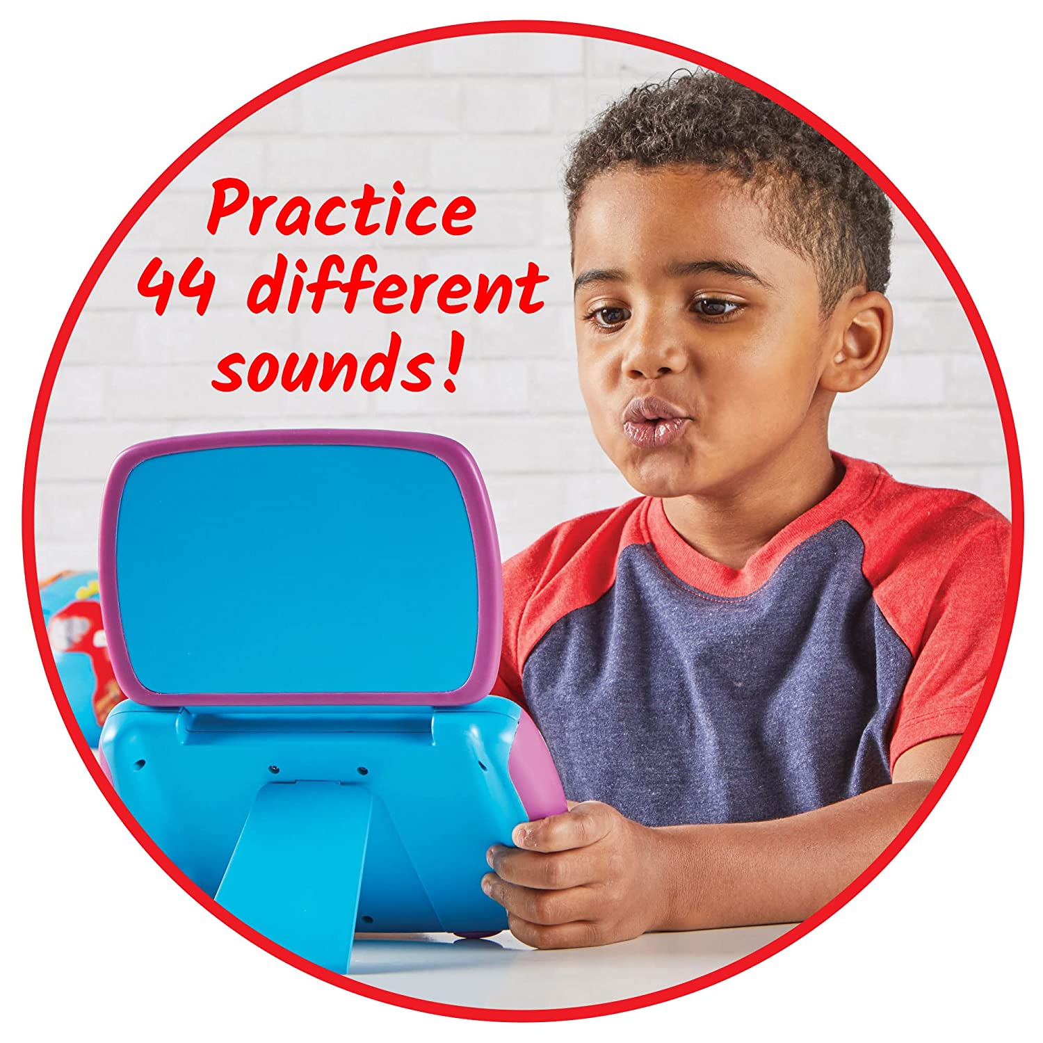 An infographic that says: Practice 44 different sounds! A child with medium skin tone and short curly hair looks into the Mirror My Sounds Phoneme Set and their mouth is in the "sh" position.