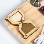 A look at the hourglass on the Assistex Wooden Fidget Busy Board for Adults with Alzheimer's Style B.