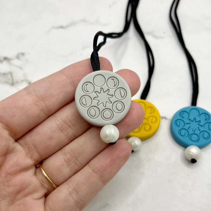 The grey Moon Phases Fidget Necklace.