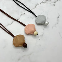 The Shell Chewy Fidget Necklace.