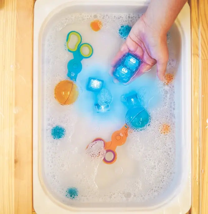 The Cookie Monster Glo Pals Sesame Street Cubes 4-Pack in water.