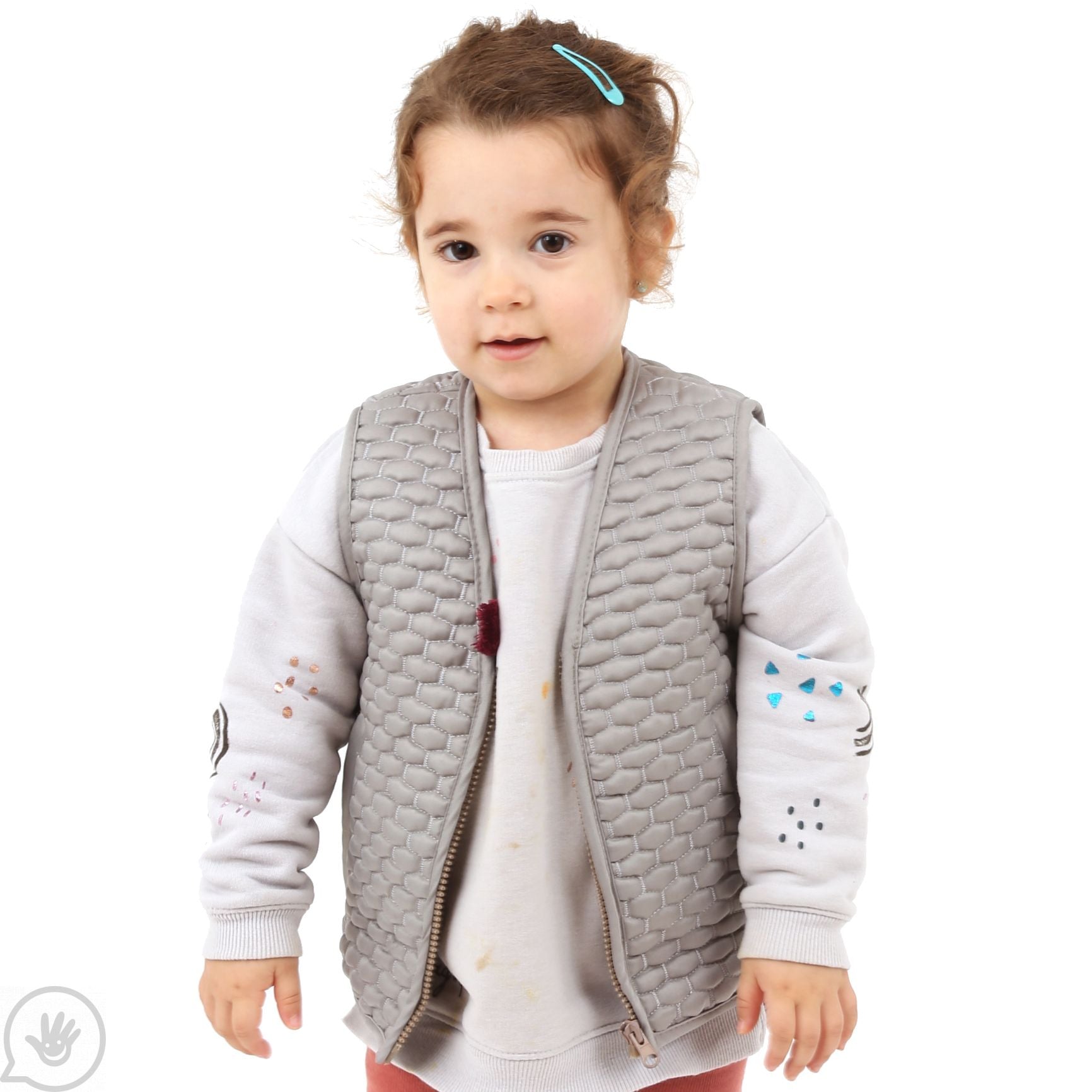 A child with light skin tone and brown hair wears the Kids Honeycomb Weighted Vest over a beige sweatshirt.