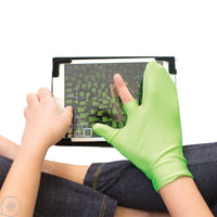 A child with light skin tone holds an iPad on their lap. On their right hand is the Pointer Finger Isolator. They are moving something on the screen.
