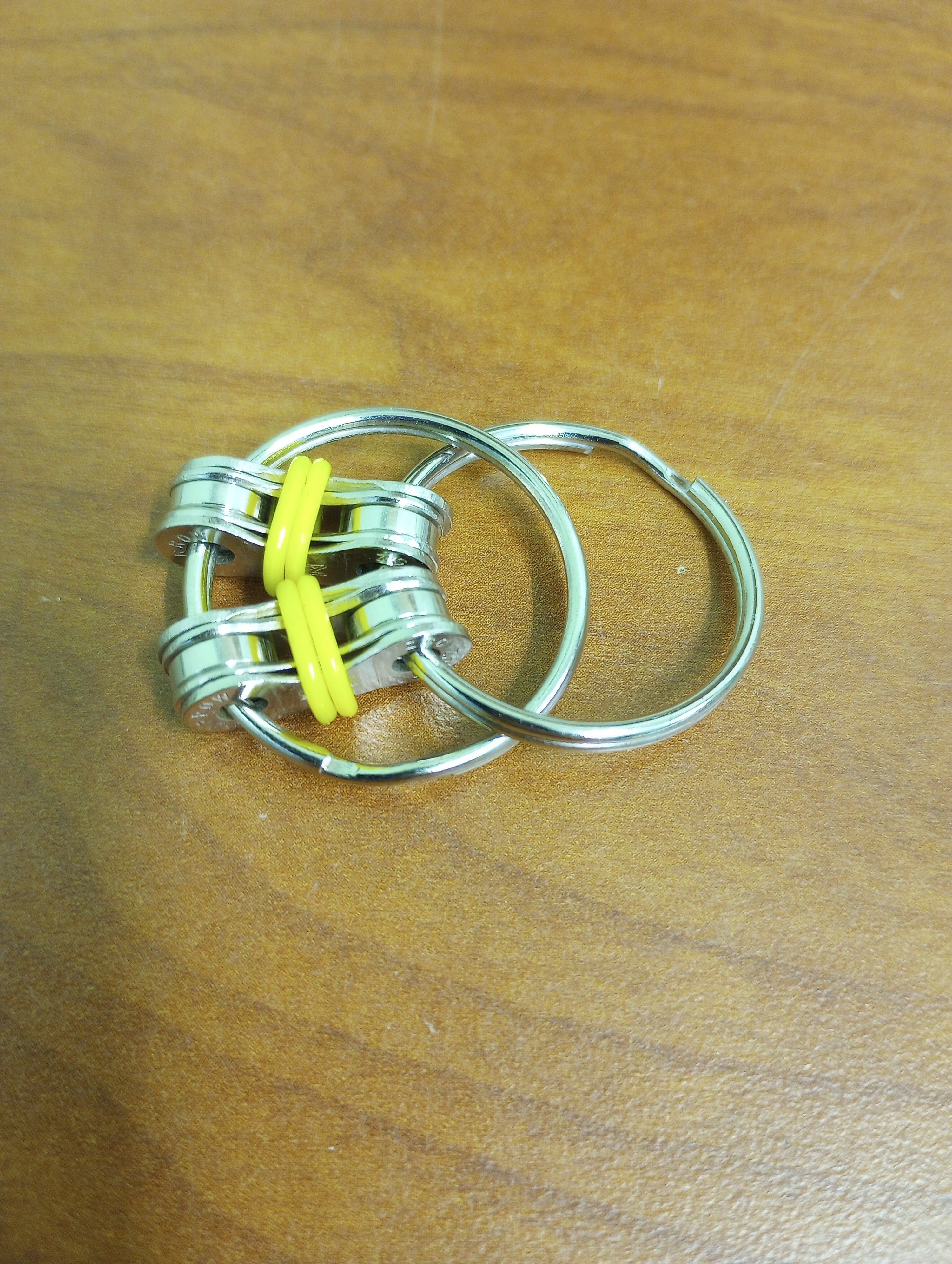 The yellow Bike Chain Fidget.