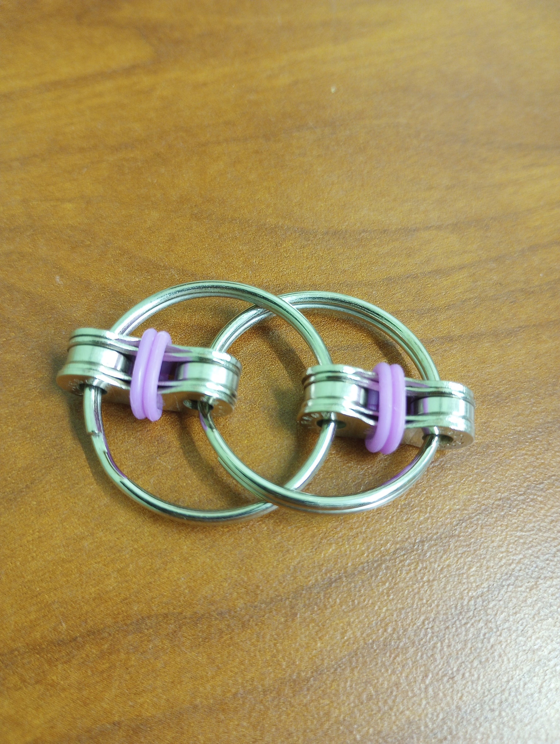 The pink Bike Chain Fidget.