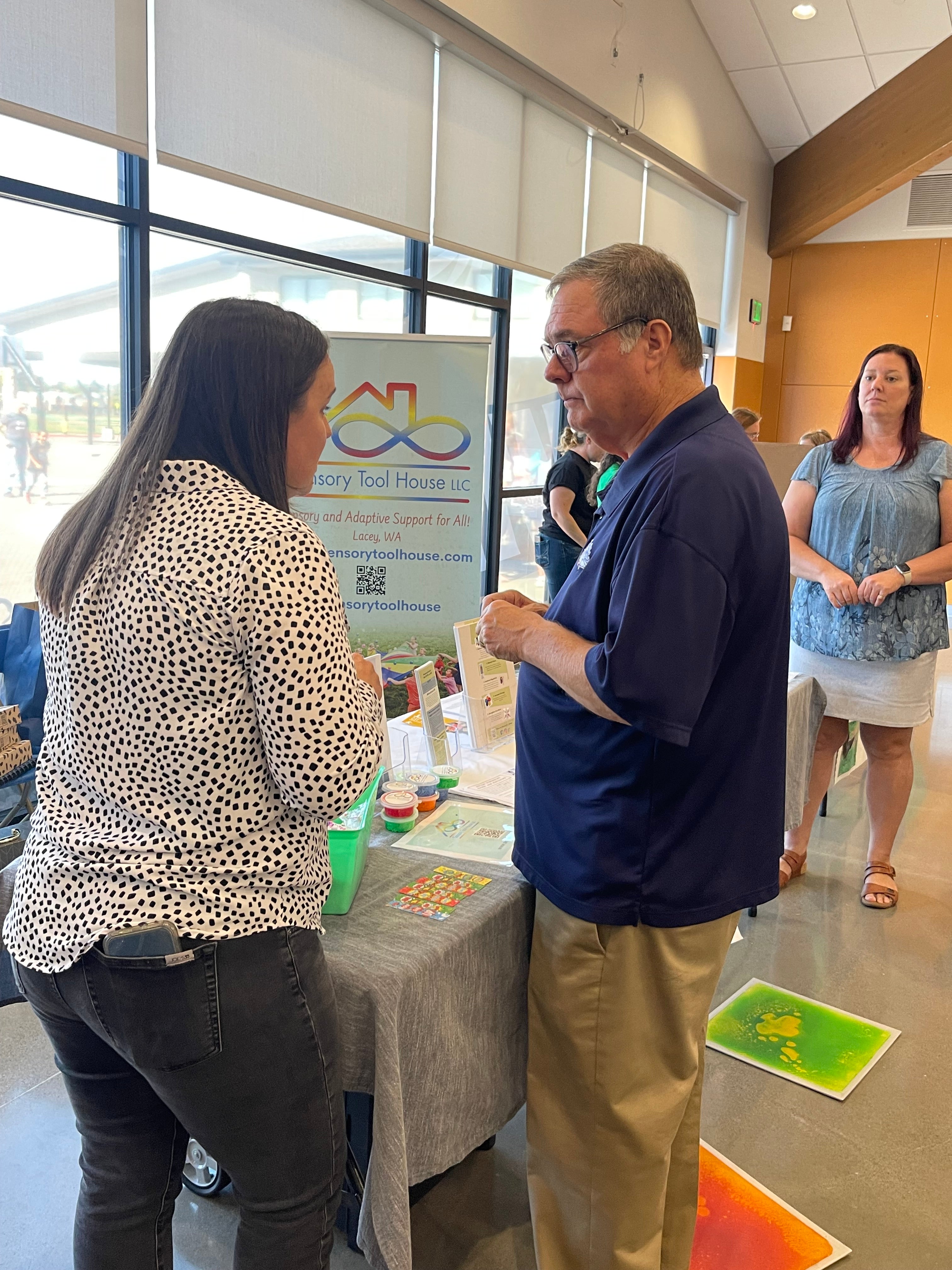 Lt. Gov. Denny Heck Speaking with  Staff at Sensory Tool House