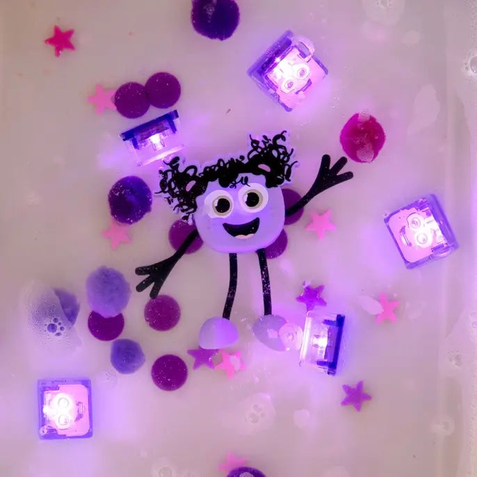 Glo Pals Light-Up Sensory Toy Lumi lit up in a tub.