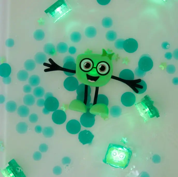 Glo Pals Light-Up Sensory Toy Pippa lit up in a tub.