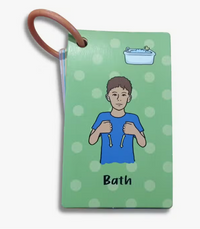 A colorful Baby's First Words Sign Language Flash Card that shows someone signing "Bath."