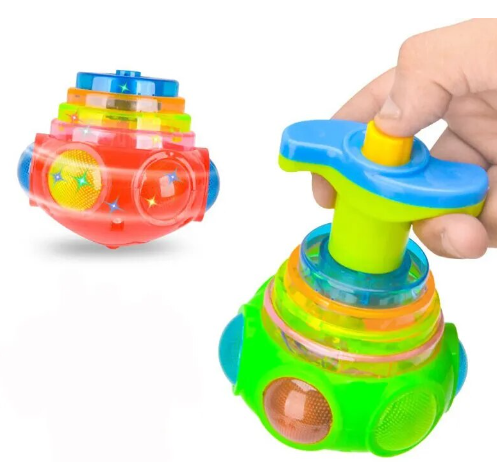 A hand with light skin tone presses the button on the Light Up Musical Top Gyroscope.