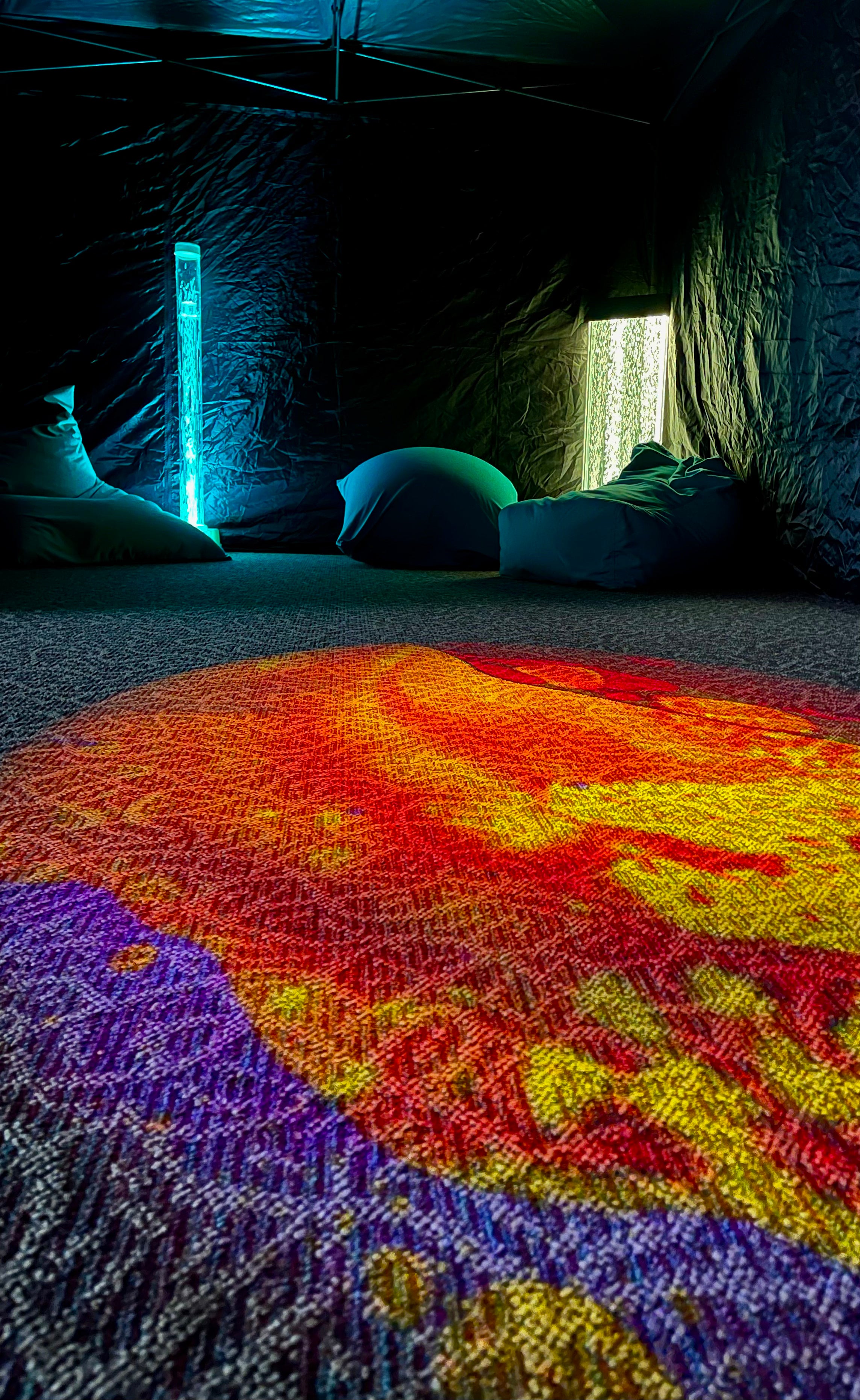 Sensory Room with bubble wall and tubes along with soft seating