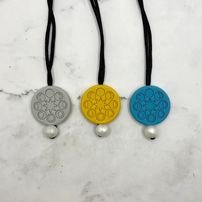 The three colors of the Moon Phases Fidget Necklace.