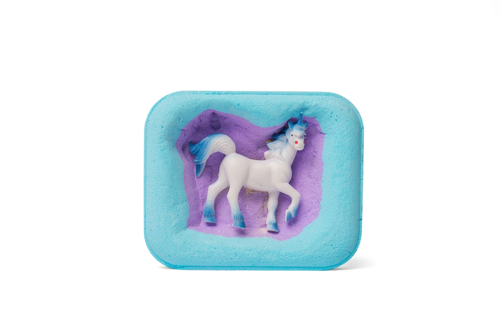 The hidden side of the Mega Unicorn Surprise Bath Bomb with one of the versions of the toy unicorn.