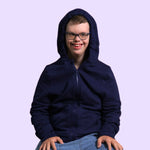 An adult smiles with the hood up on their Navy Adult QuietSense™ Zippered Sound Reducing Sensory Hoodie.