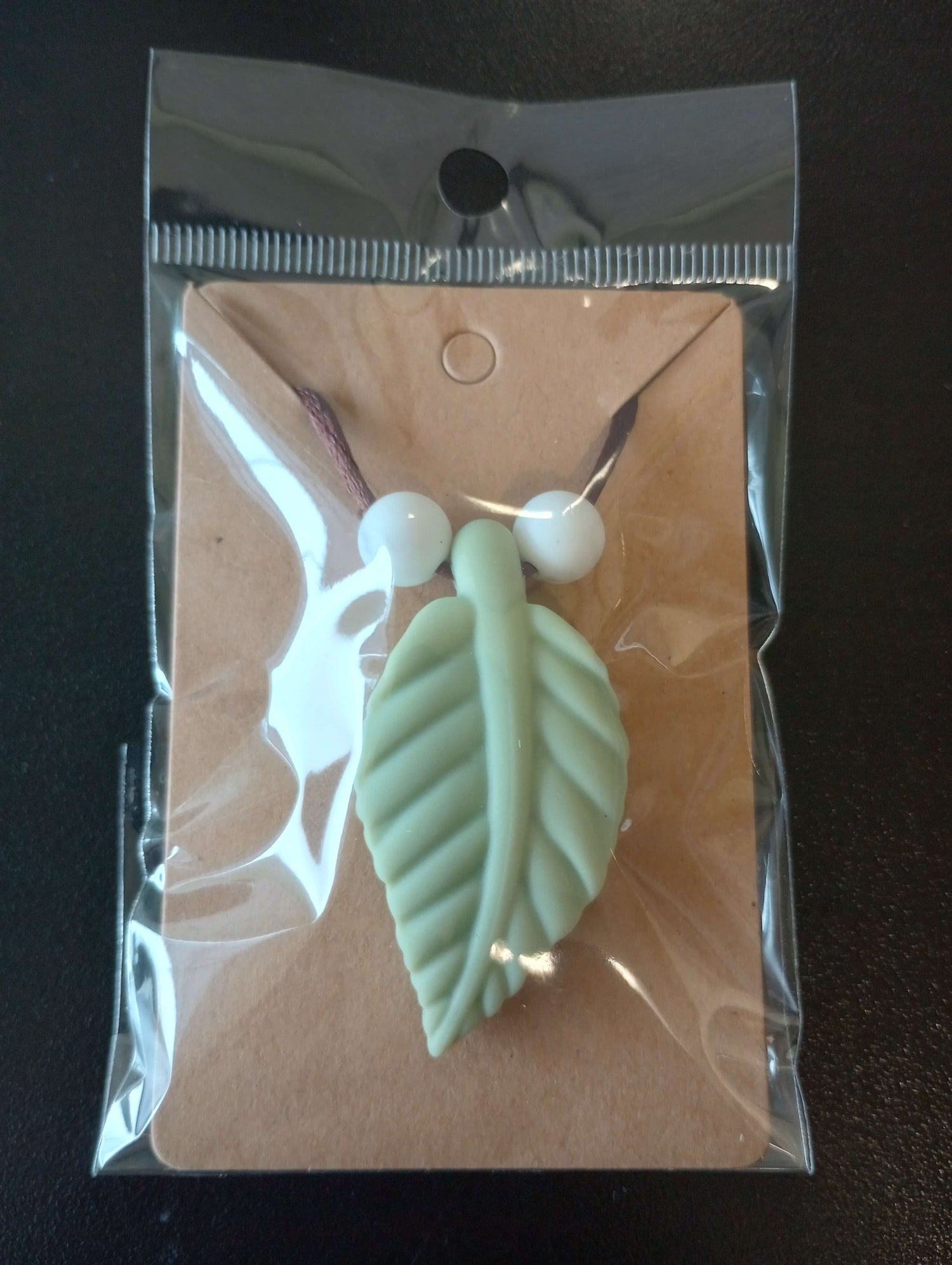 The Sage Green Large Leaf Chewy Fidget Necklace.