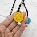 The yellow Moon Phases Fidget Chewable Jewelry Necklace.