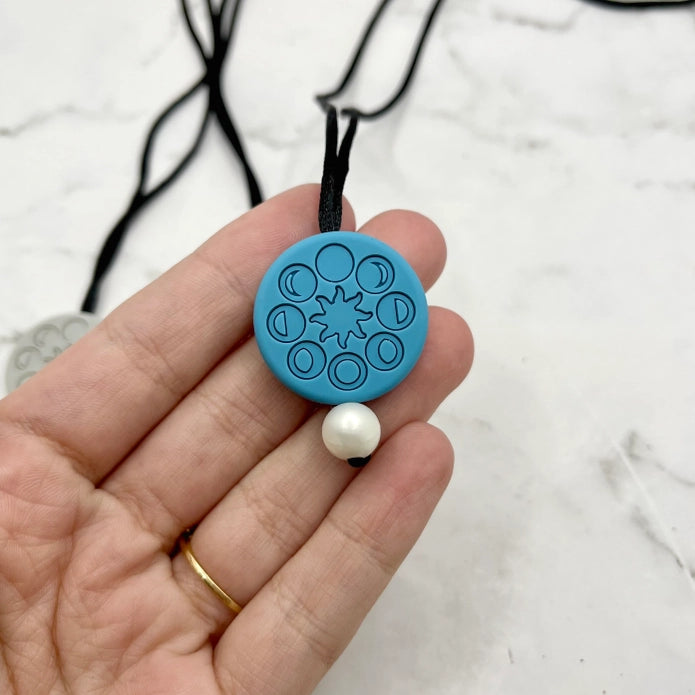 The blue Moon Phases Fidget Chewable Jewelry Necklace.