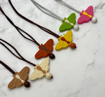 A colorful array of the Moth Fidget Chewable Jewelry Necklace.