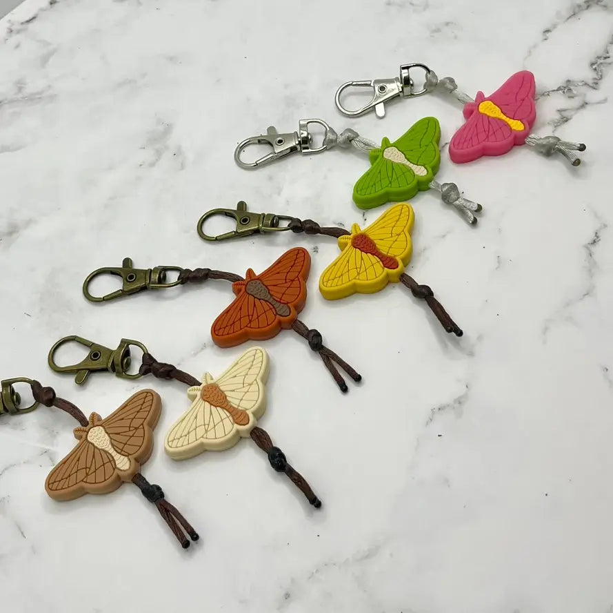 The assorted colors of the ArtisXan Moth Zipper Pull/Keychain/Chewy Fidget.