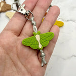 The green Moth Chewy Fidget Zipper Pull/Keychain.