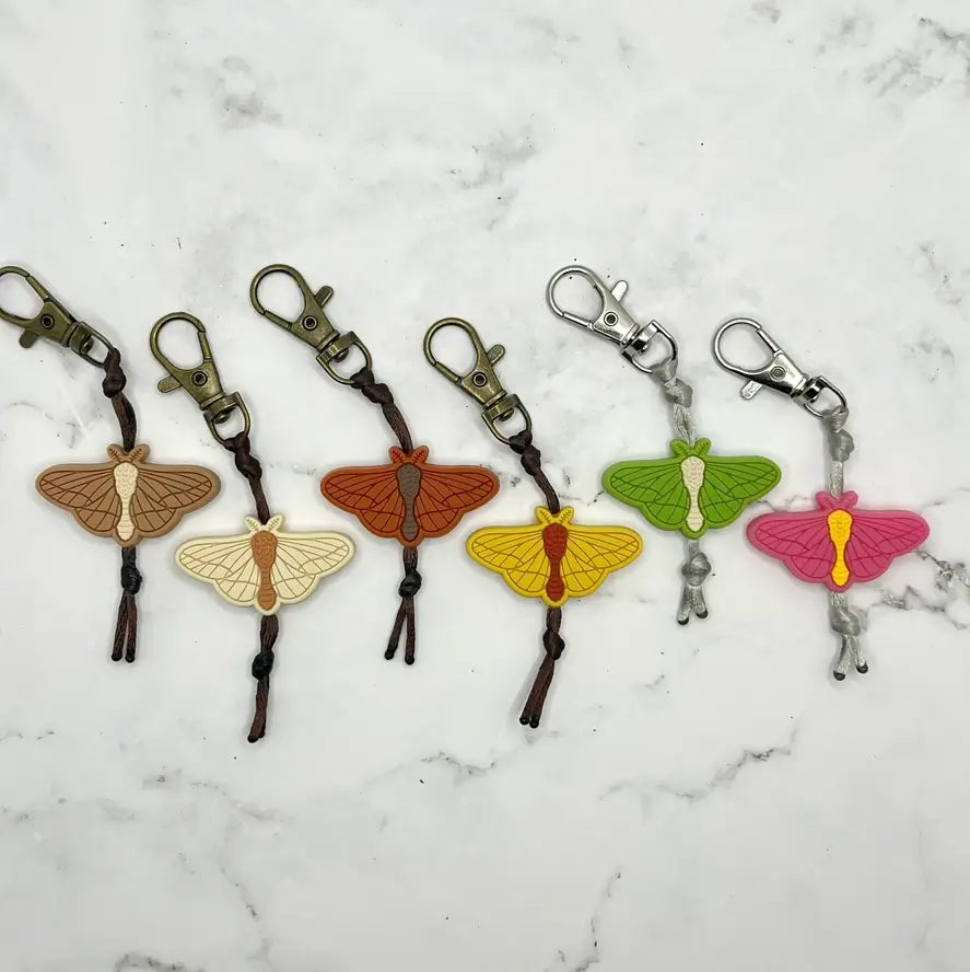The assorted colors of the ArtisXan Moth Zipper Pull/Keychain/Chewy Fidget.