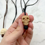 The brown speckled Skull Fidget Chewable Jewelry Necklace.