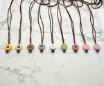 Several varieties of the Small Flower Silicone Chewy Fidget Necklace.