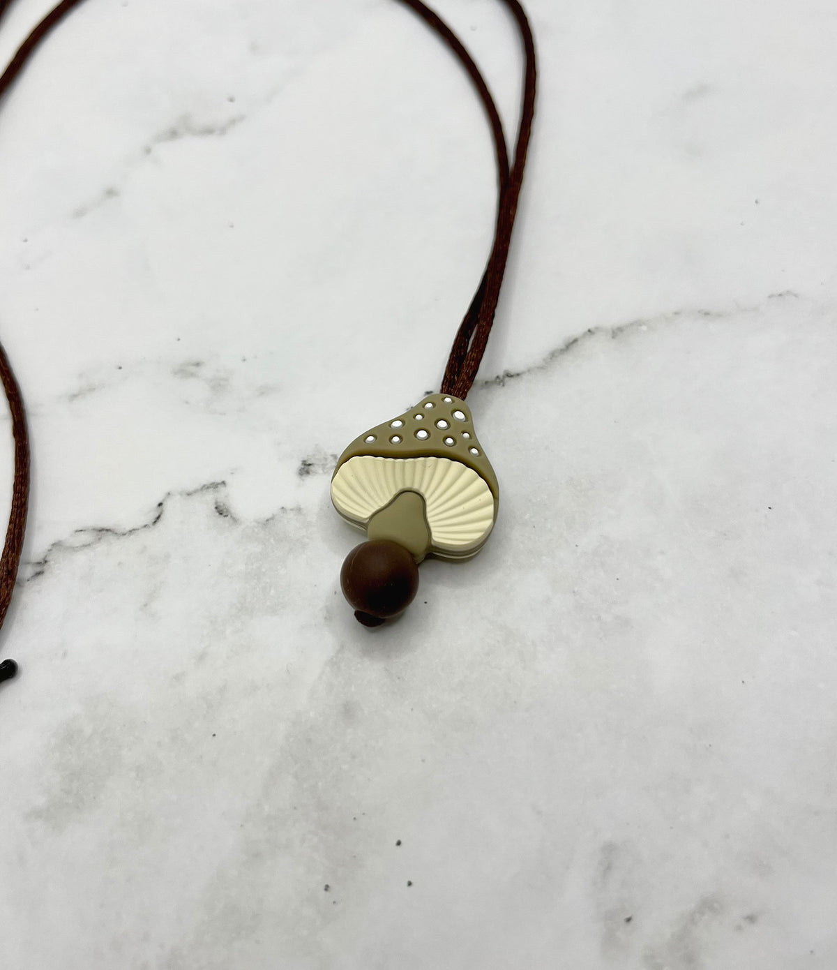 The grey Spotted Mushroom Fidget Chewable Jewelry Necklace.