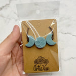 The Blue Crescent Moon Phases Fidget Necklace.