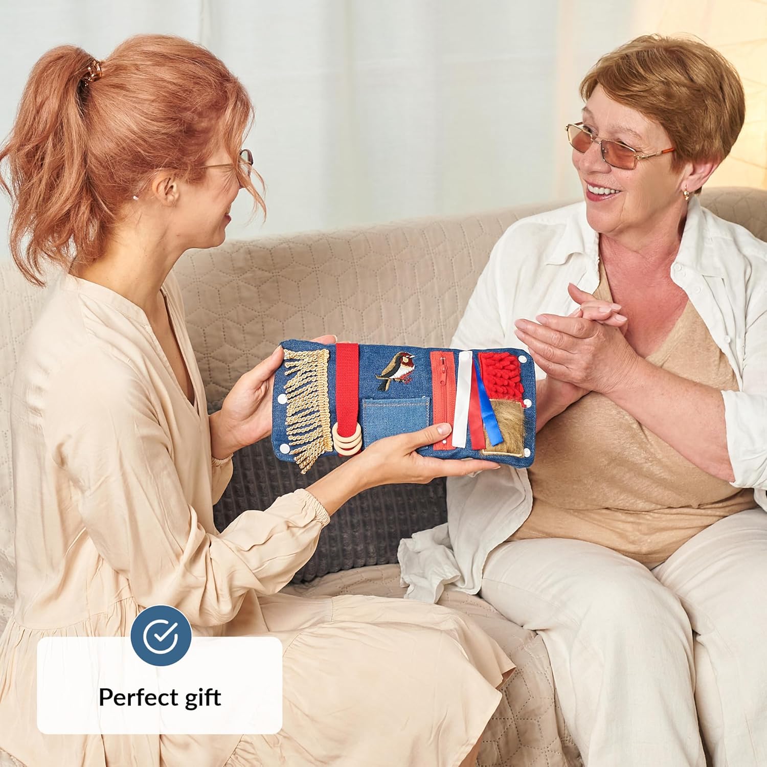 A woman gifts the Blue Fidget Wrist Cuff to someone.