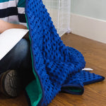 An up-close look at the minky texture of the Bouncyband Kids Soft Fleece Sensory Weighted Blanket - 7 lb.